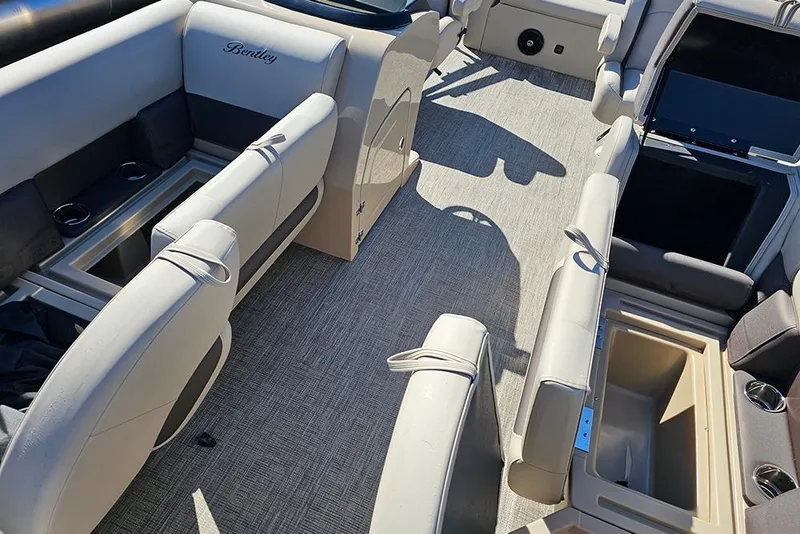 Slide: The Image of 2026 Bentley Pontoons Legacy 220 Swingback interior with luxurious seating and storage compartments. - 20