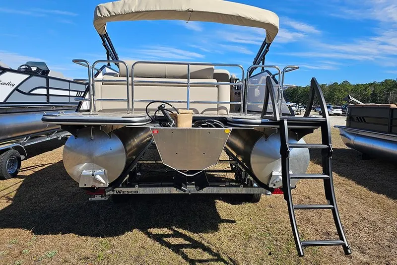 Slide: The Image of 2026 Bentley Pontoons Legacy 220 Swingback with ladder and canopy, parked on grass. - 8