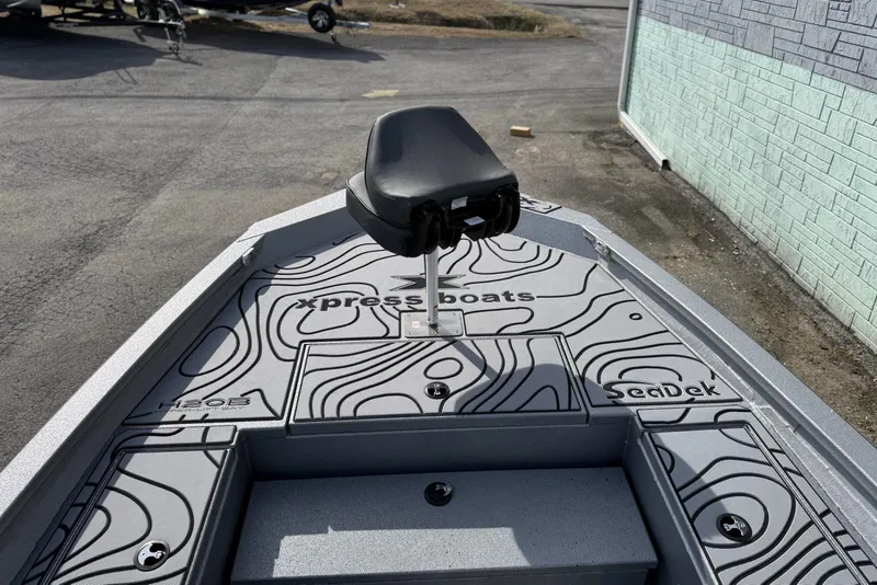 Slide: The Image of 2026 Xpress H20B Bay boat deck with SeaDek flooring and seat. - 10