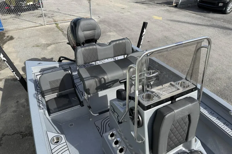 Slide: The Image of 2026 Xpress H20B Bay boat interior with seating and console, featuring modern design and functionality. - 11