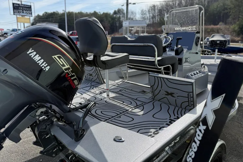 Slide: The Image of 2026 Xpress H20B Bay boat with Yamaha engine, featuring sleek interior and modern design. - 13