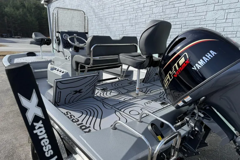 Slide: The Image of 2026 Xpress H20B Bay boat with Yamaha engine, featuring sleek design and modern seating. - 6