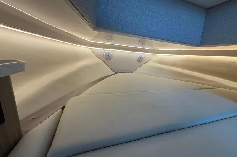 Slide: The Image of Interior cabin of 2020 Regal 38 SAV boat with modern lighting and seating. - 20
