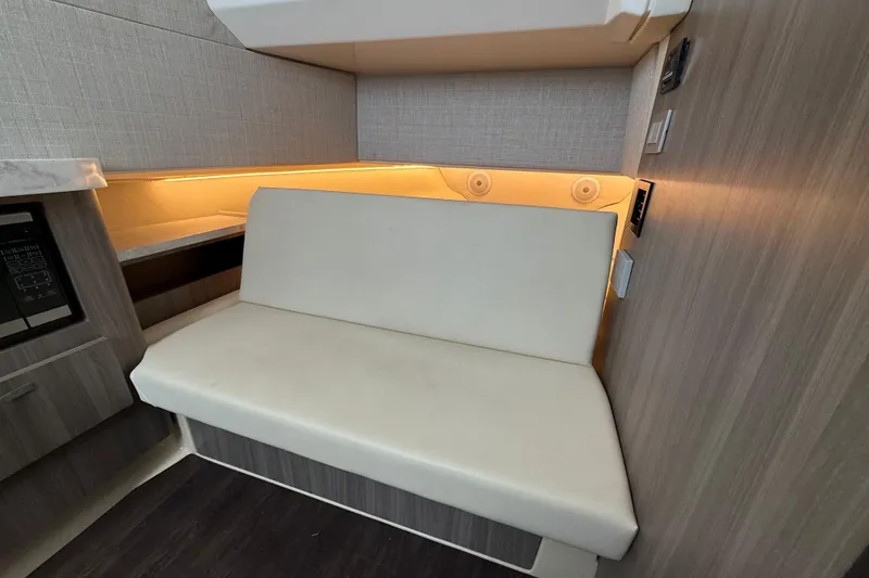 Slide: The Image of 2020 Regal 38 SAV interior with beige seating and ambient lighting. - 21