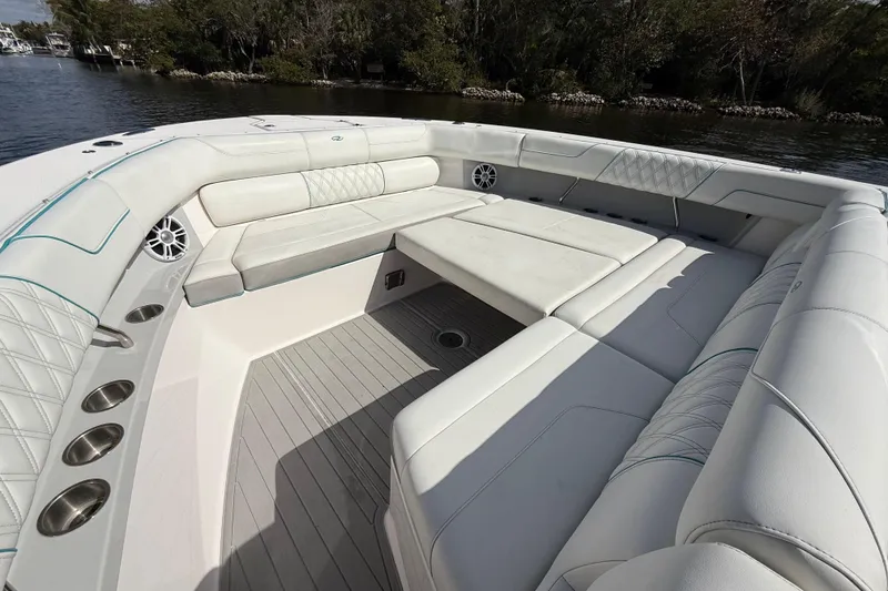Slide: The Image of Luxurious seating area on 2020 Regal 38 SAV boat, featuring elegant white upholstery. - 25
