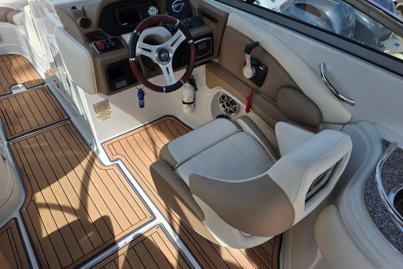 Slide: The Image of 2017 Crownline Eclipse E6 XS boat interior with wood flooring and modern helm. - 11