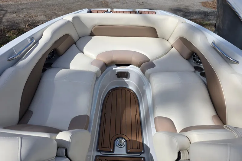 Slide: The Image of 2017 Crownline Eclipse E6 XS boat interior with beige and white seating. - 17