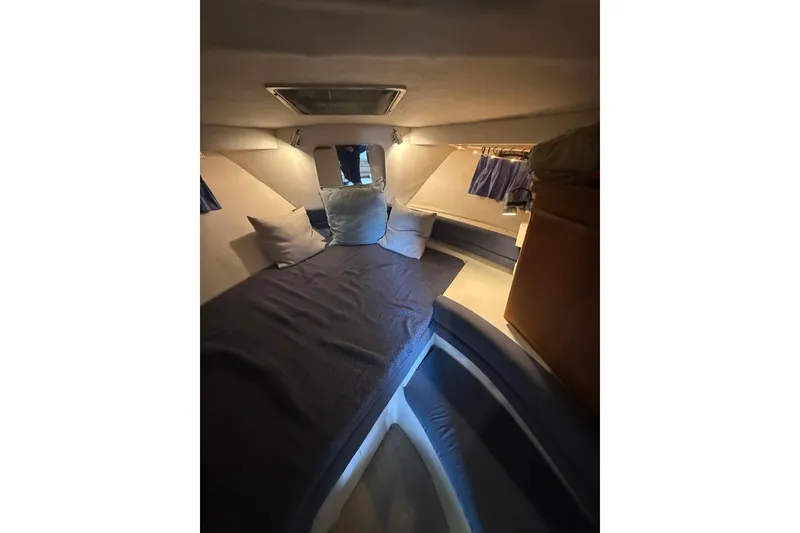 Slide: The Image of Cozy cabin interior of 1994 Carver 320 Voyager with bed and pillows. - 17