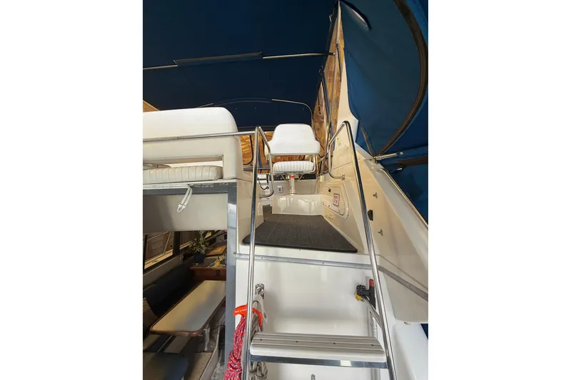 Slide: The Image of Interior view of 1994 Carver 320 Voyager yacht with seating and stairs. - 20