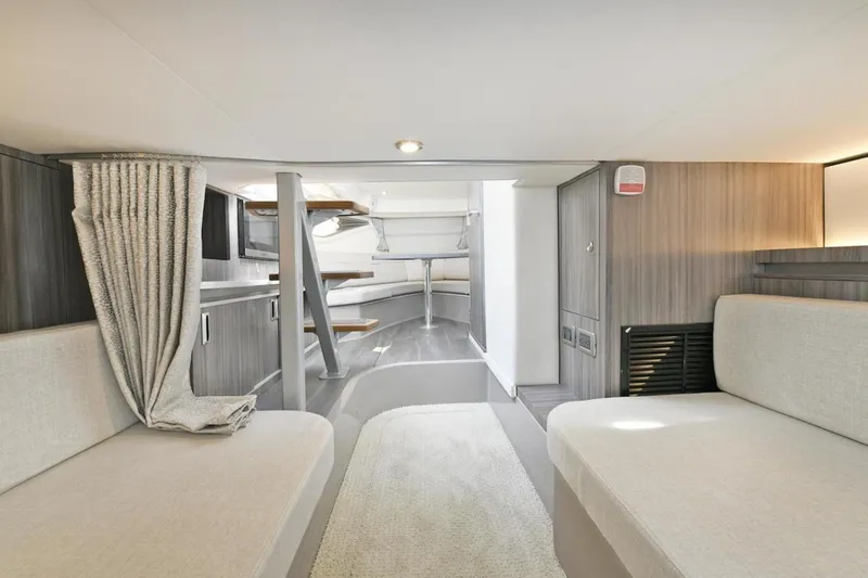 Slide: The Image of Interior of 2022 Sea Ray Sundancer 320 yacht, featuring modern seating and elegant design. - 16