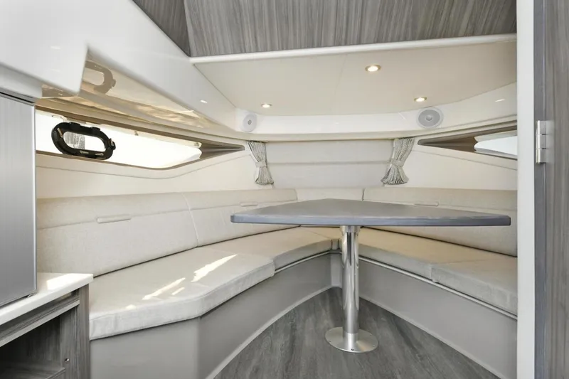 Slide: The Image of 2022 Sea Ray Sundancer 320 interior with modern seating and table. - 17