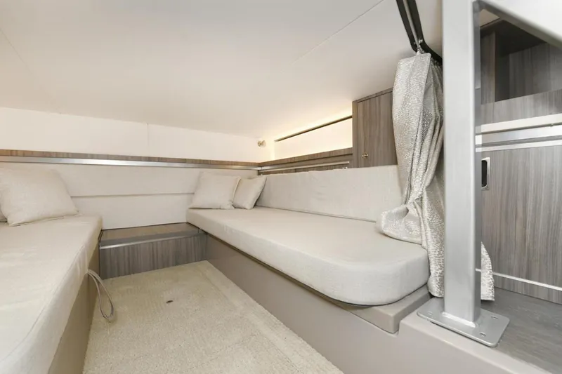 Slide: The Image of Interior cabin of 2022 Sea Ray Sundancer 320 with modern seating and neutral decor. - 18