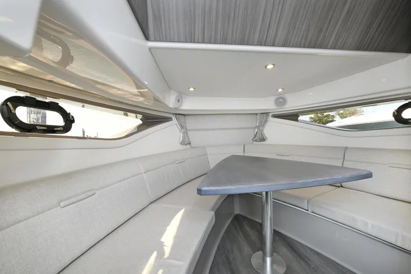 Slide: The Image of Interior of 2022 Sea Ray Sundancer 320 yacht with modern seating and table. - 19
