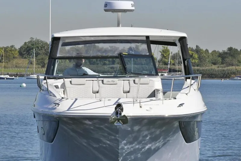 Slide: The Image of 2022 Sea Ray Sundancer 320 yacht on calm water, front view. - 3