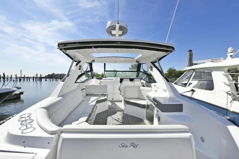 Slide: The Image of 2022 Sea Ray Sundancer 320 yacht interior with luxurious seating and open deck. - 5