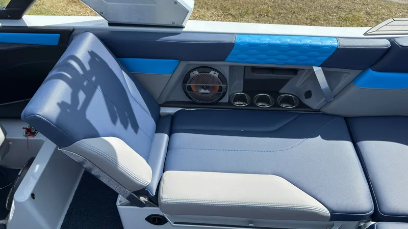 Slide: The Image of Interior of 2022 MasterCraft XT24 with blue seating and speaker. - 13