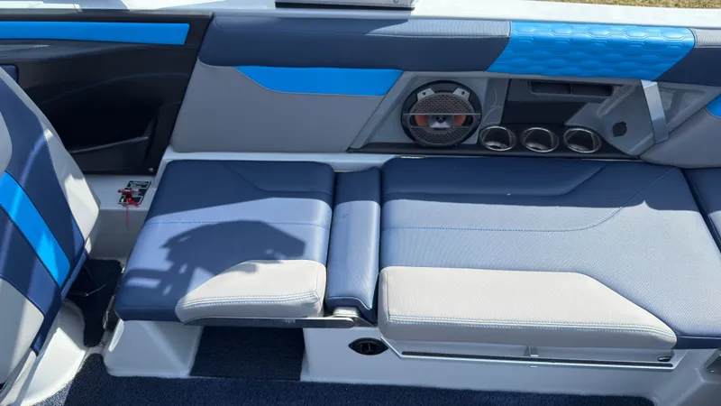 Slide: The Image of Interior of 2022 MasterCraft XT24 with blue and gray seating. - 14