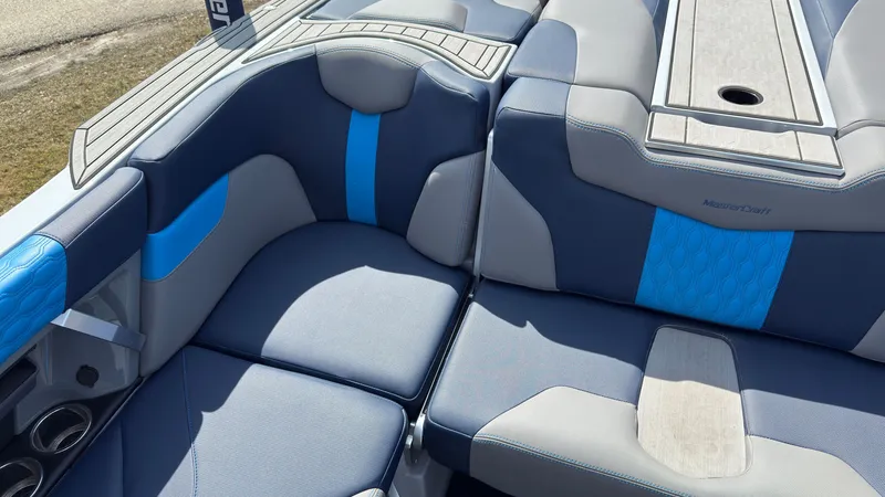 Slide: The Image of Interior of 2022 MasterCraft XT24 with blue and gray upholstery. - 15