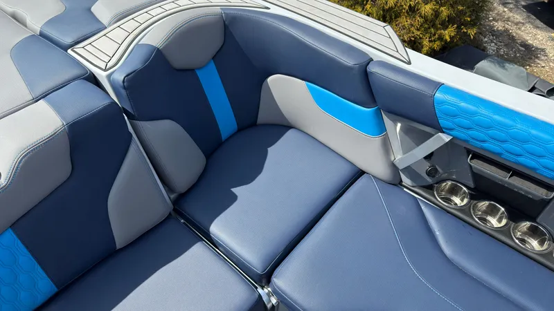 Slide: The Image of Interior of 2022 MasterCraft XT24 with blue and gray upholstery. - 17