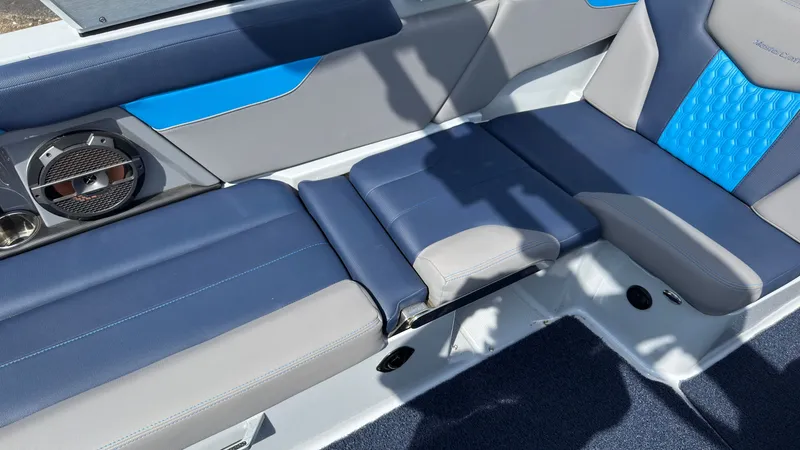Slide: The Image of Interior of 2022 MasterCraft XT24 with blue and gray seating. - 18
