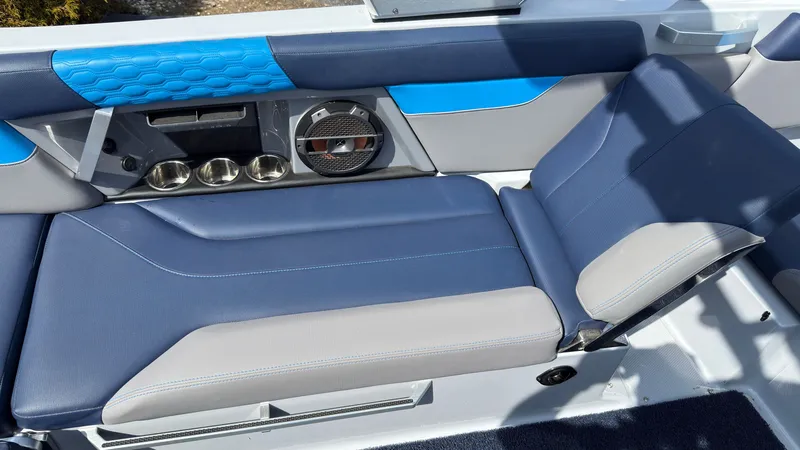 Slide: The Image of Interior of 2022 MasterCraft XT24 with blue and gray seating. - 19