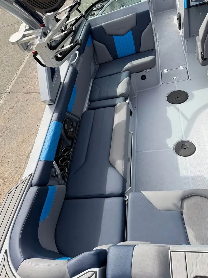 Slide: The Image of 2022 MasterCraft XT24 boat on trailer, side view. - 2