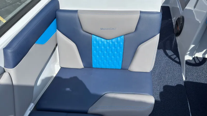 Slide: The Image of MasterCraft XT24 2022 boat seat with blue and gray upholstery. - 20