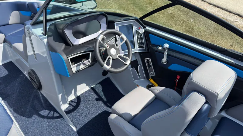 Slide: The Image of Interior of 2022 MasterCraft XT24 with modern helm station. - 22