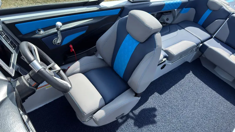 Slide: The Image of Interior of 2022 MasterCraft XT24 with blue and gray seating. - 23