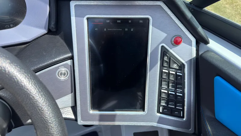 Slide: The Image of MasterCraft XT24 2022 boat console with touchscreen and controls. - 28