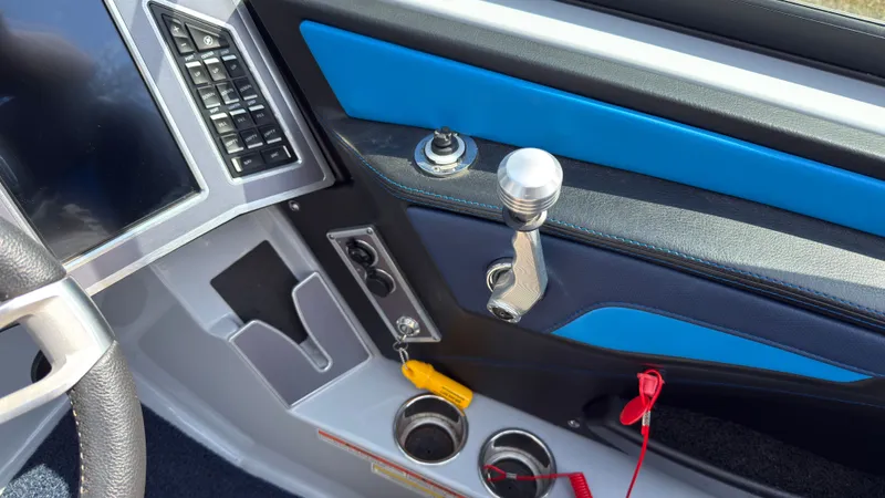 Slide: The Image of Interior of 2022 MasterCraft XT24 with gear lever and controls. - 30