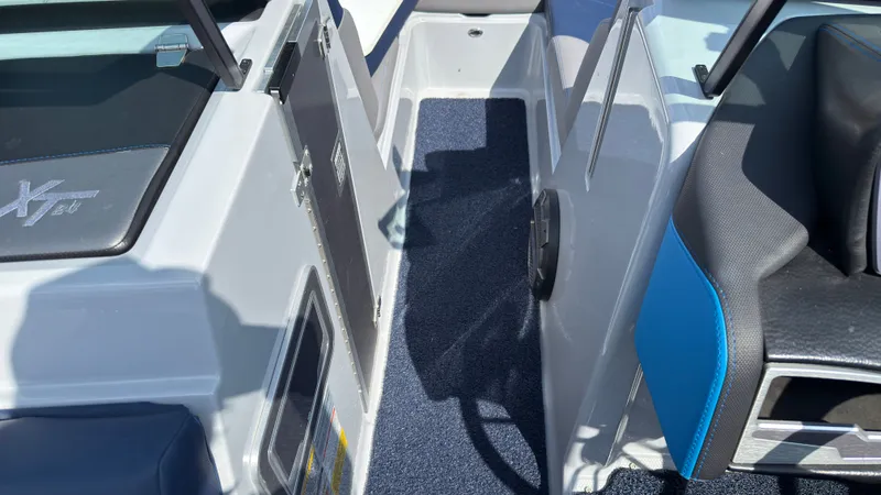 Slide: The Image of Interior of 2022 MasterCraft XT24 boat with blue accents. - 32