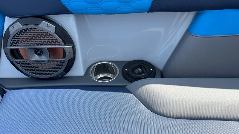Slide: The Image of MasterCraft XT24 2022 boat speaker and cup holder detail view. - 39