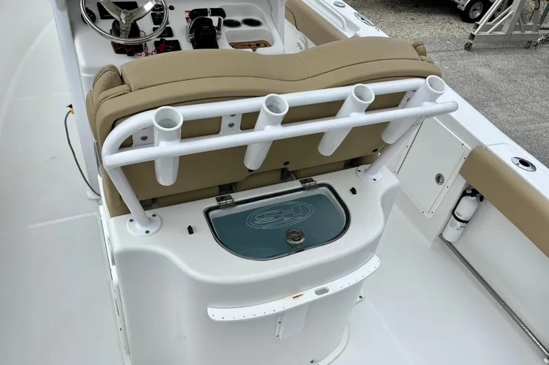 Slide: The Image of 2018 Sea Hunt Gamefish 27 Coffin Box boat interior with rod holders and seating. - 17