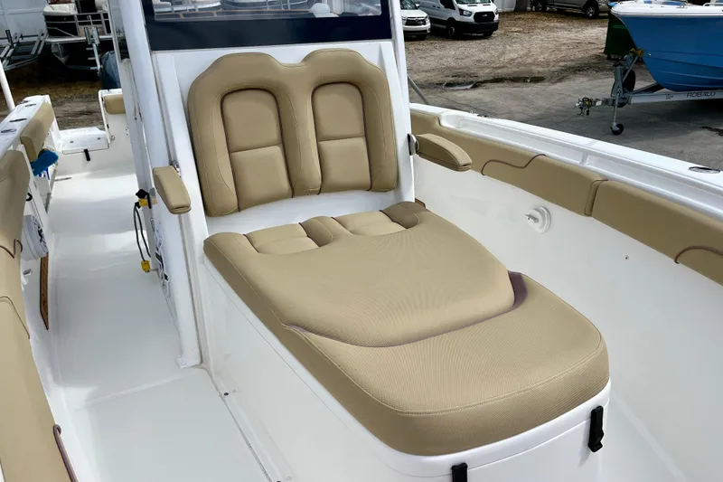 Slide: The Image of 2018 Sea Hunt Gamefish 27 Coffin Box with beige seating, showcasing luxury and comfort. - 29