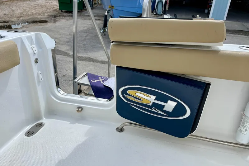 Slide: The Image of 2018 Sea Hunt Gamefish 27 Coffin Box boat interior with SH logo and seating. - 36
