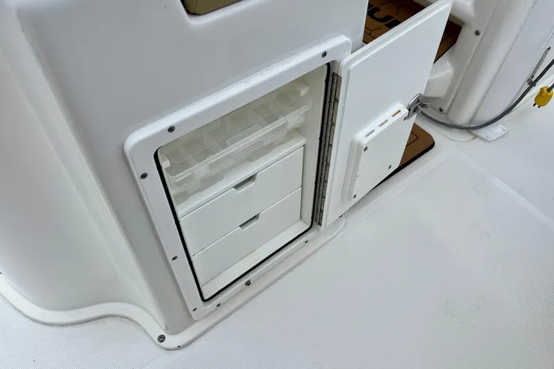 Slide: The Image of 2018 Sea Hunt Gamefish 27 Coffin Box storage compartment with open drawers. - 37