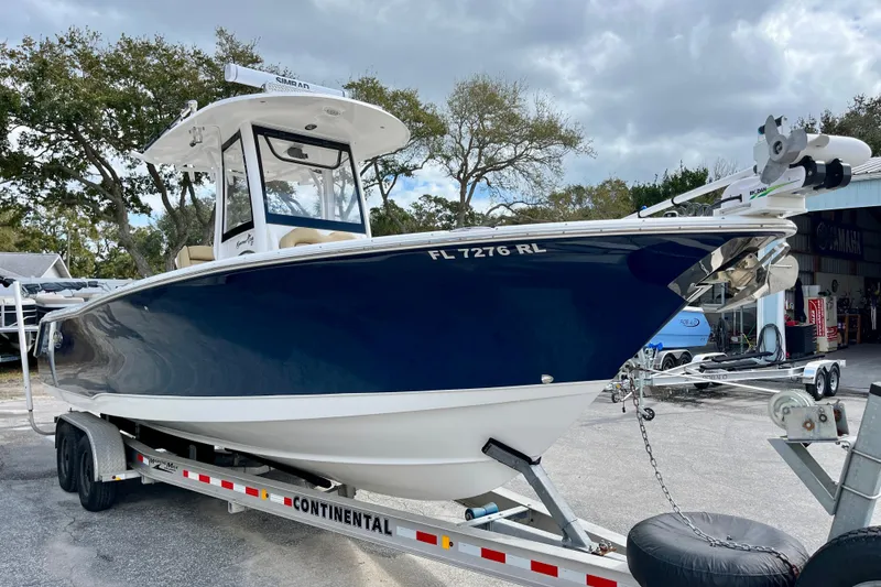 Slide: The Image of 2018 Sea Hunt Gamefish 27 Coffin Box boat on trailer, parked outdoors. - 6