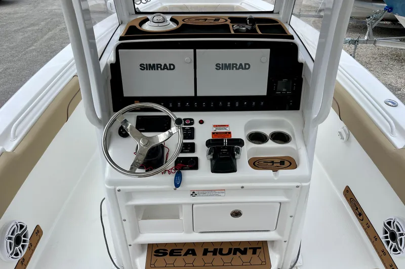 Slide: The Image of 2018 Sea Hunt Gamefish 27 Coffin Box helm with Simrad electronics and steering wheel. - 8