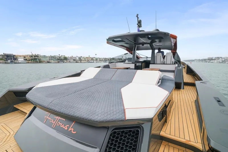 Slide: The Image of Luxurious 2025 Maori 64 yacht with spacious deck and modern design on calm waters. - 12