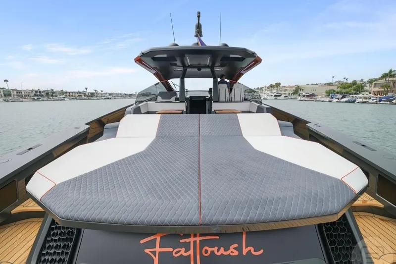 Slide: The Image of 2025 Maori 64 yacht with spacious deck, docked in a marina. - 13