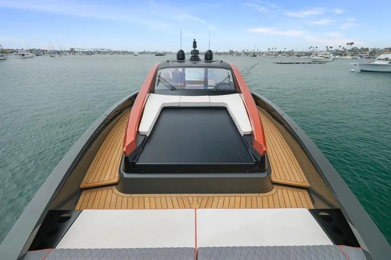Slide: The Image of Luxury Maori 64 yacht cruising in a serene harbor, showcasing sleek design and modern features. - 16