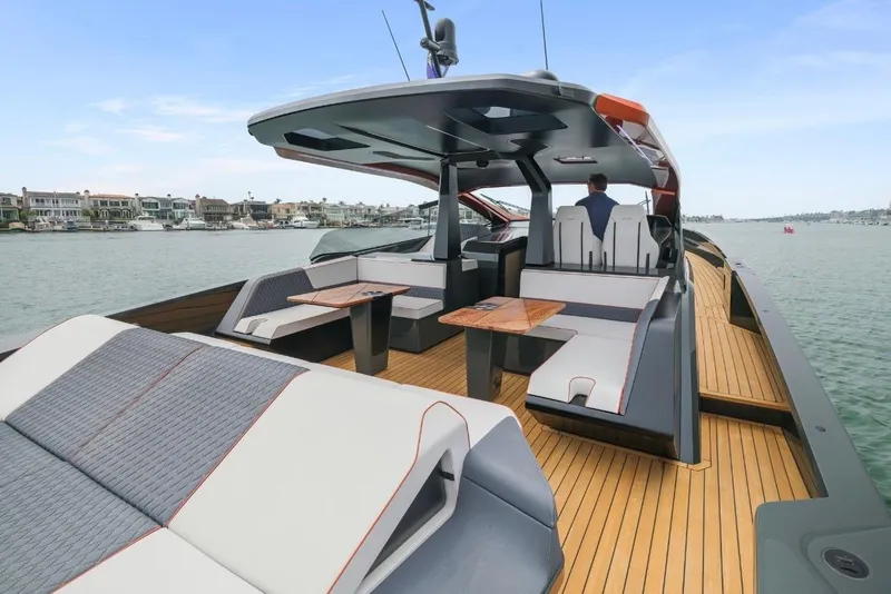 Slide: The Image of Luxurious 2025 Maori 64 yacht with sleek design and spacious deck on calm waters. - 17