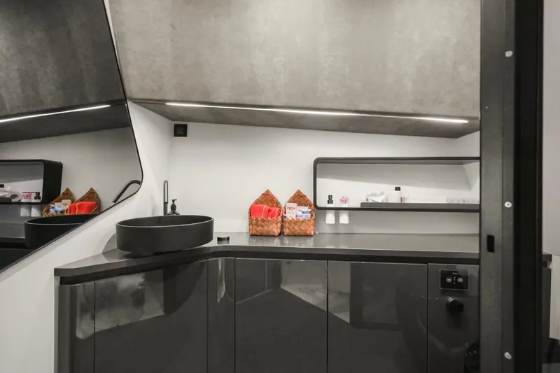 Slide: The Image of Modern bathroom interior in 2025 Maori 64 yacht, featuring sleek black sink and minimalist design. - 20