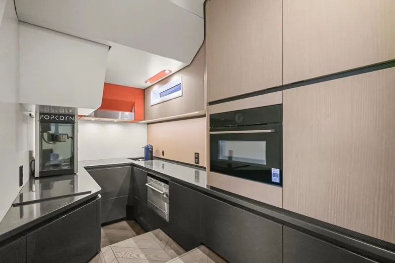 Slide: The Image of Modern kitchen in 2025 Maori 64 yacht with sleek cabinetry and built-in appliances. - 23