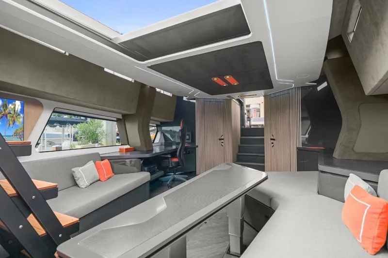 Slide: The Image of Luxurious interior of 2025 Maori 64 yacht with modern seating and sleek design. - 28