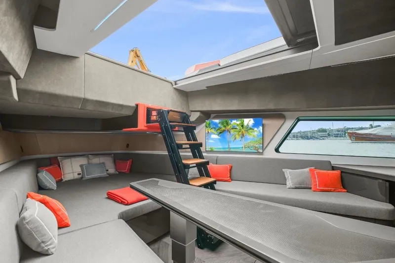 Slide: The Image of Luxurious interior of 2025 Maori 64 yacht with modern seating and scenic windows. - 29