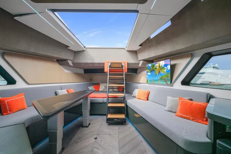 Slide: The Image of Luxurious interior of 2025 Maori 64 yacht with modern design and vibrant orange accents. - 30