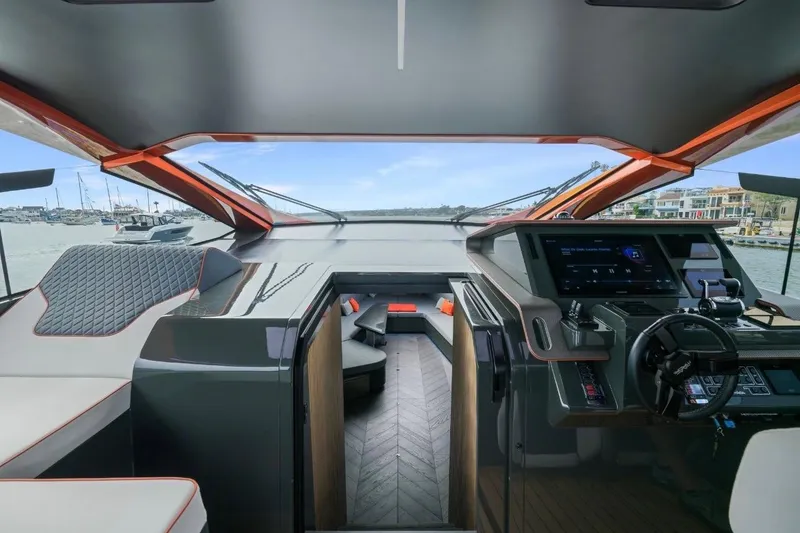 Slide: The Image of Interior view of 2025 Maori 64 yacht cockpit with modern controls and luxurious seating. - 32