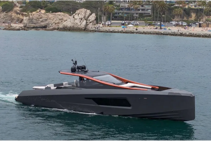 Slide: The Image of Futuristic 2025 Maori 64 yacht cruising near a scenic coastline. - 6